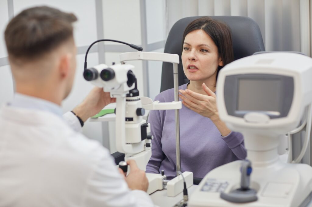 Woman speaking with Eye Doctor during an eye exam